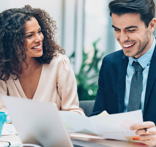 Mother and daughter sitting at the dinning table. The daughter is drawing